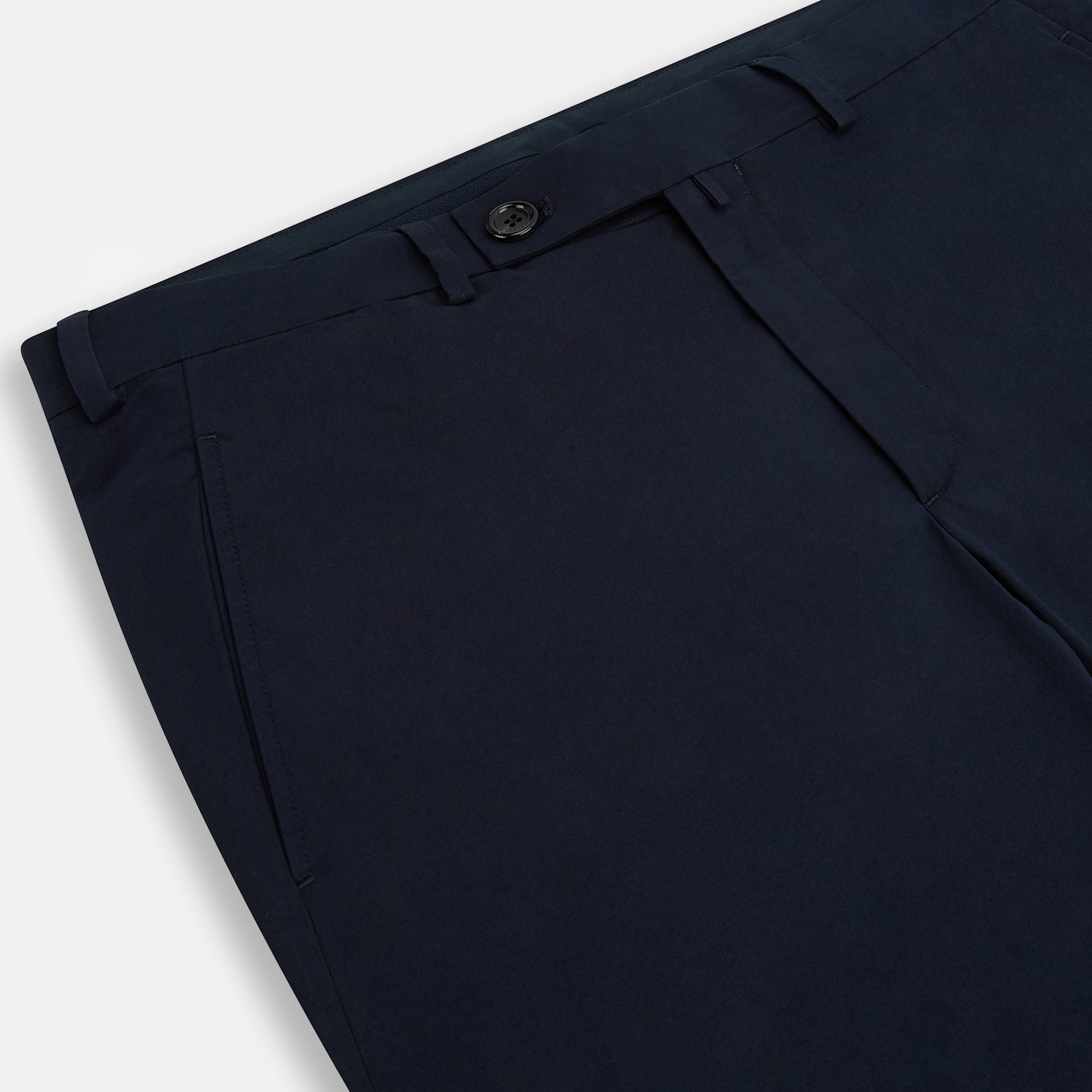 View 10 of product Turnbull & Asser’s Midnight Blue Winston Trousers, in high-twist cotton with belt loops and a button closure, are shown flat against a plain white background.