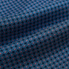 View 4 of product The Turnbull & Asser Navy and Red Rosette Cravat is adorned with a repeating geometric pattern of red, white, and light blue circles—an ideal formal accessory displayed against a white background.