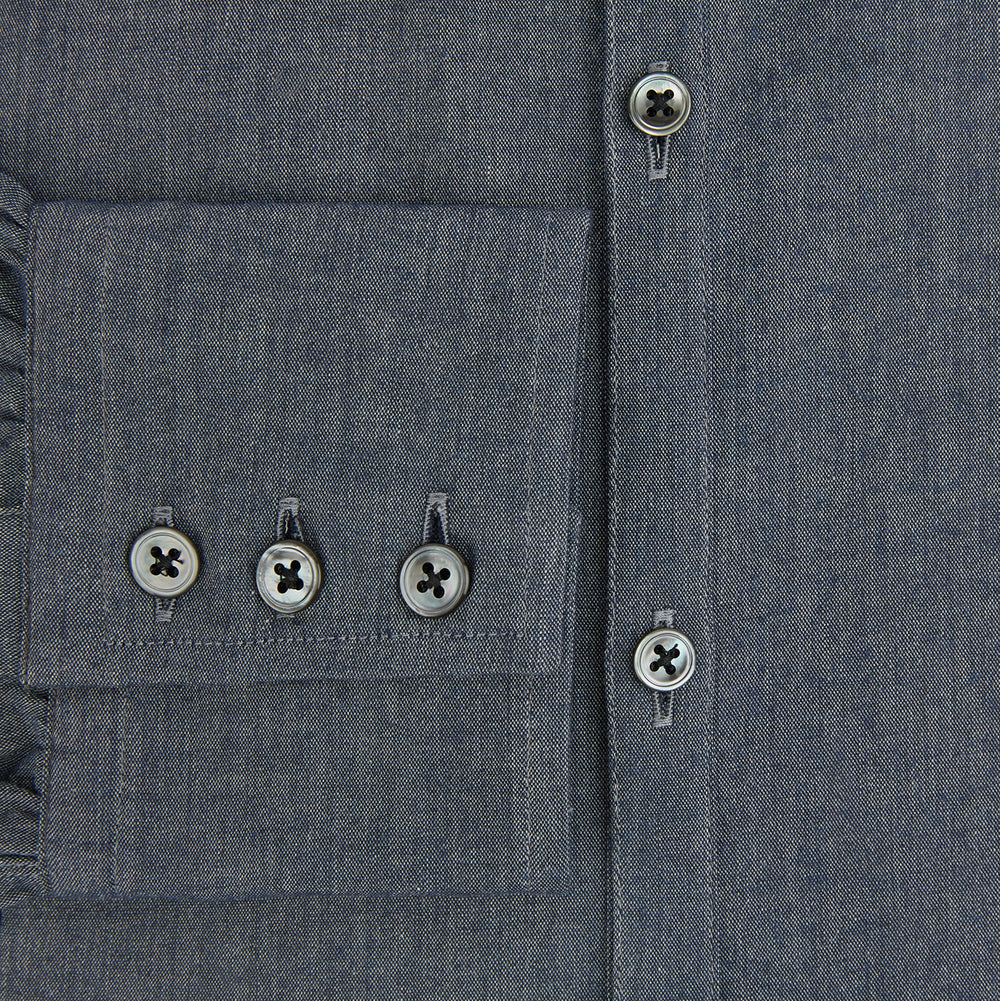 The Turnbull & Asser Azzurro Westminster Shirt in dark grey features long sleeves, a classic collar, buttoned cuffs, and a straight hem, showcased against a white background, highlighting refined British craftsmanship.