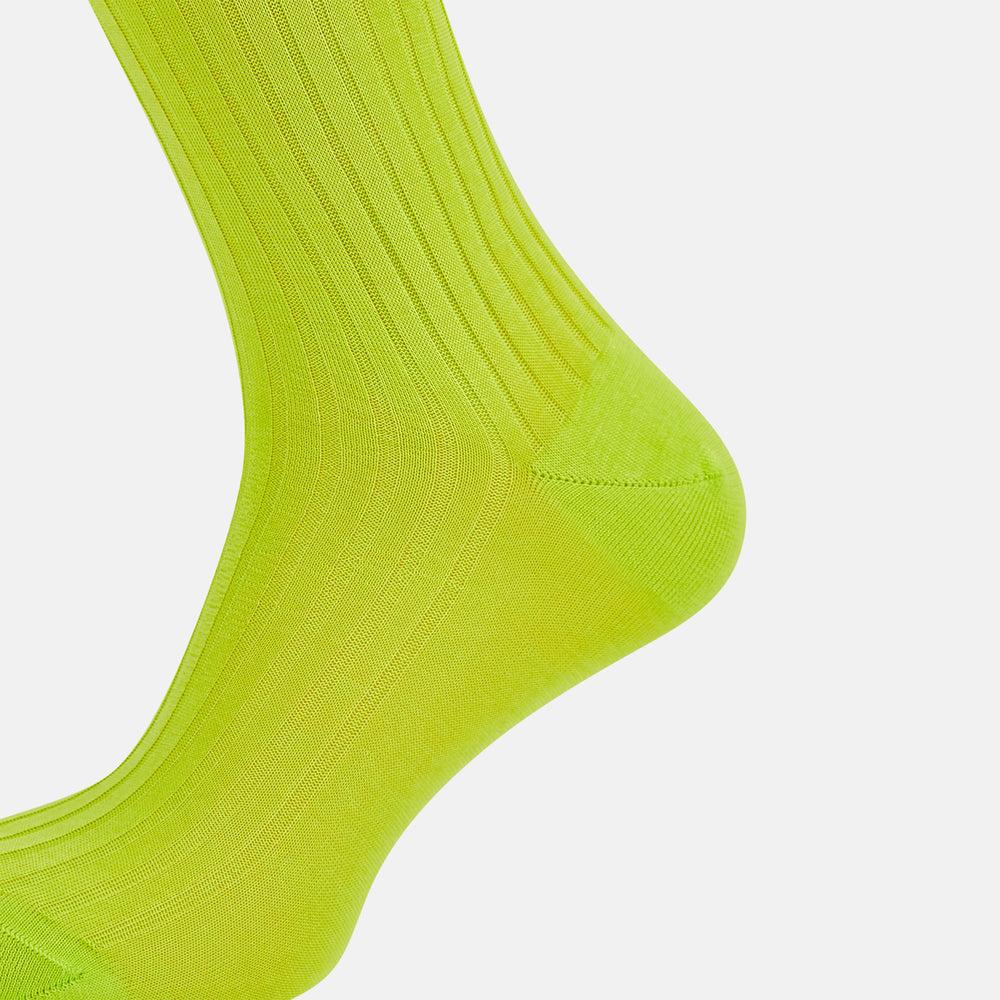 The Turnbull & Asser Lime Mid-Length Sock is crafted from soft mercerised cotton with a ribbed texture and shown against a plain light gray background.