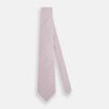 View 2 of product The Turnbull & Asser Lilac Flower-Patterned Printed Silk Tie, featuring a light lilac hue and small white circular designs, is shown rolled up against a plain white background.
