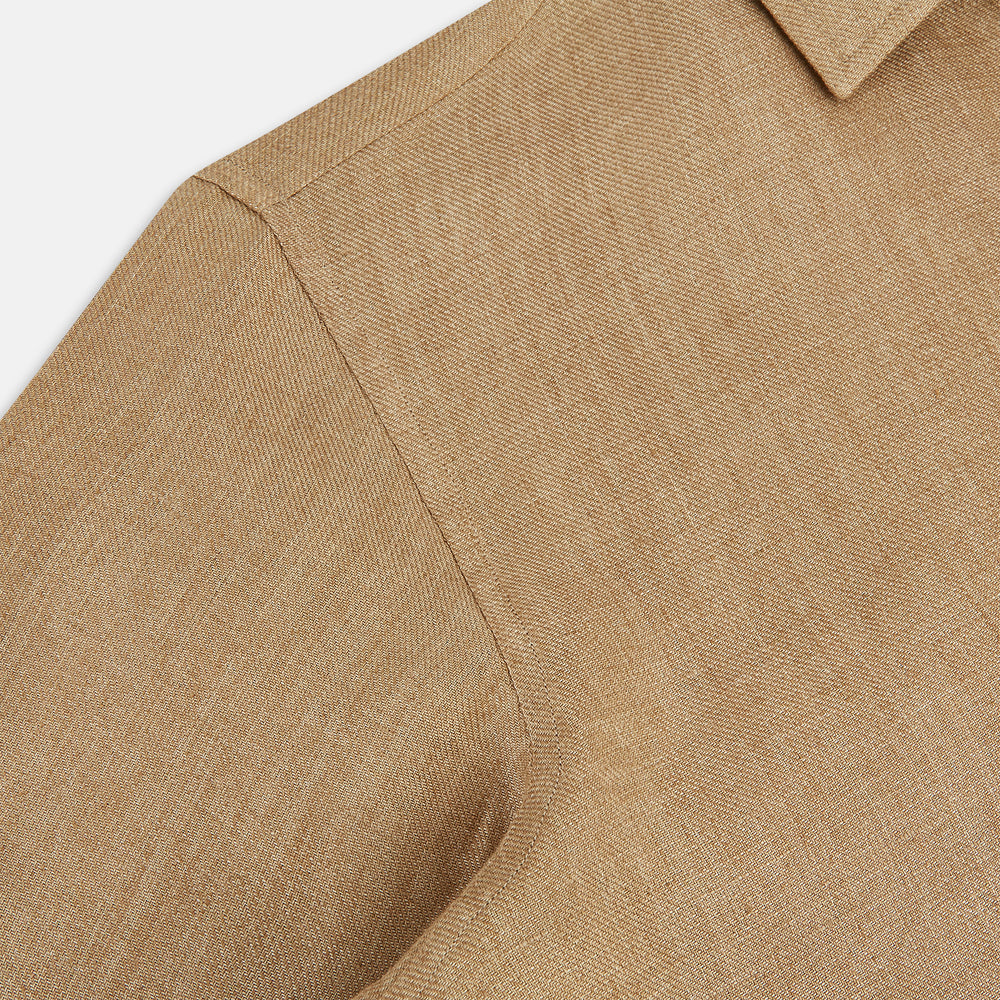 The Turnbull & Asser Camel Linen Windsor Shirt features long sleeves, a tailored fit, and classic collar in light brown camel linen, shown against a white background.