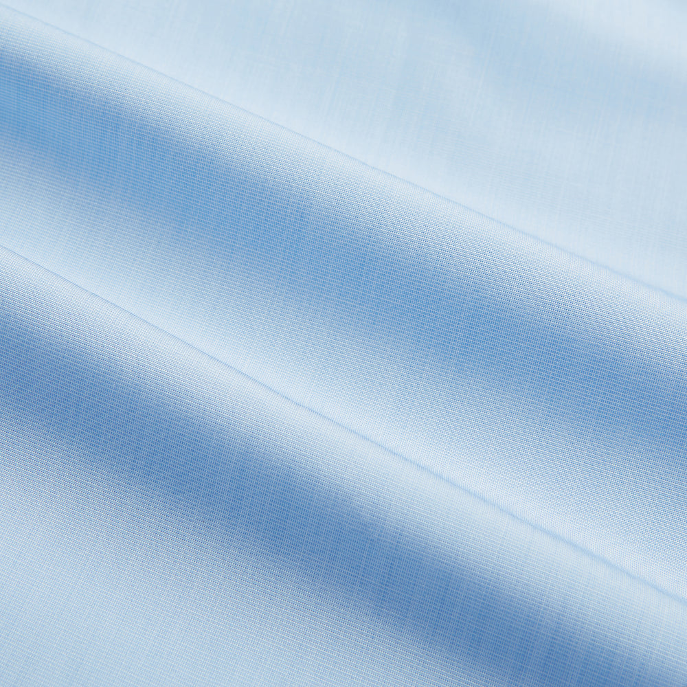 The Turnbull & Asser Light Blue End-on-End Shirt features a crisp white T&A contrast collar and double cuffs, shown flat on a white background.