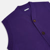 View 2 of product The Turnbull & Asser Purple Fine Merino V-Neck Sleeveless Cardigan features a button-up front and two pockets, displayed against a plain white background.