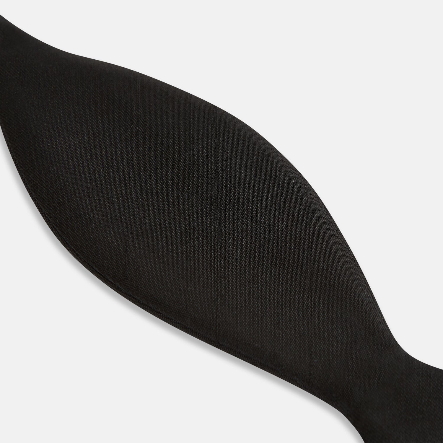 Image 5 of product The Casino Royale Bow Tie by Turnbull & Asser, as seen on James Bond, is a classic black Shantung silk bow tie with a smooth, slightly shiny finish, shown against a plain white background.
