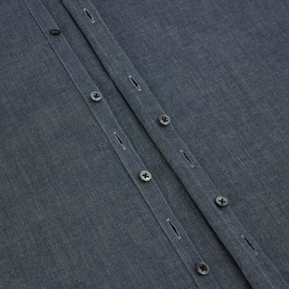 The Turnbull & Asser Azzurro Westminster Shirt in dark grey features long sleeves, a classic collar, buttoned cuffs, and a straight hem, showcased against a white background, highlighting refined British craftsmanship.