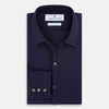 View 5 of product The Navy Textured Windsor Shirt by Turnbull & Asser features long sleeves, a Windsor collar, buttoned cuffs, and white buttons—a fine example of British craftsmanship—set against a plain white background.