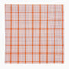 View 5 of product The Turnbull & Asser Hand Rolled Orange Graph Overlay Check Handkerchief features bold orange and white checks with blue and orange grid lines—a refined, classic accessory for any gentleman.