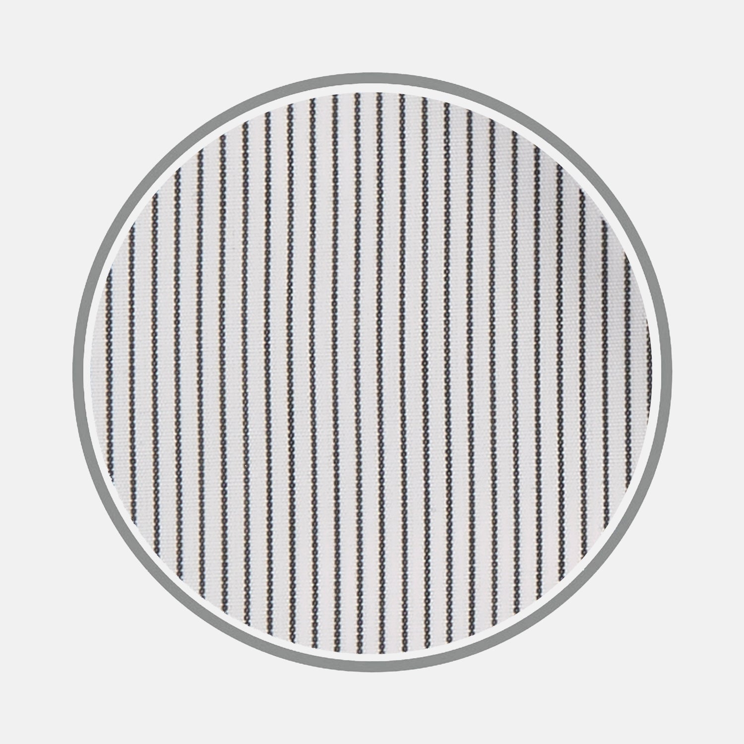 View 1 of product Close-up of Turnbull & Asser's Black Hairline Stripe Cotton Fabric, featuring evenly spaced thin black vertical stripes on white cotton, viewed through a circular frame against a light gray background.