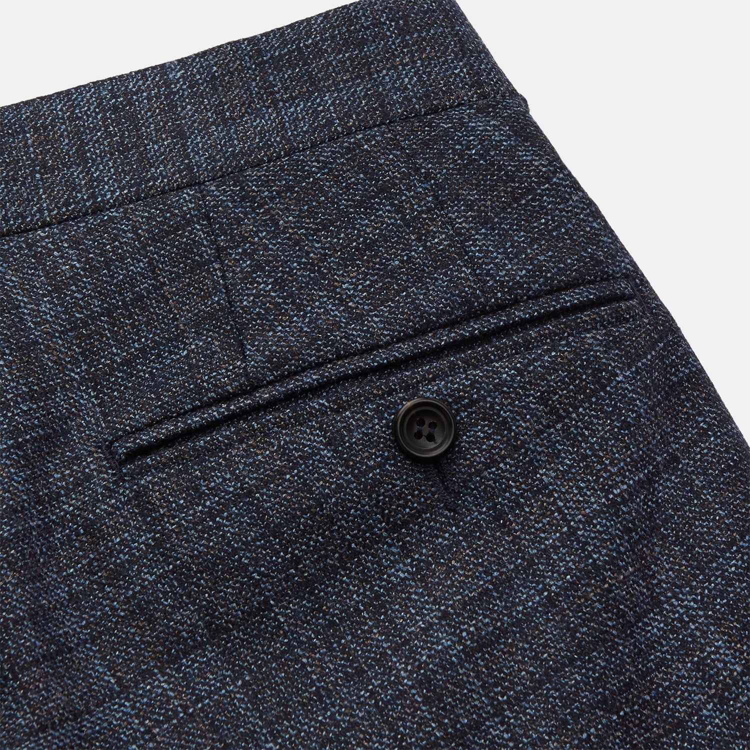 View 2 of product The Turnbull & Asser Navy Check Wool and Cashmere Blend Wilson Trousers feature a subtle plaid, belt loops, front pleats, and a straight-leg fit, displayed against a light background.