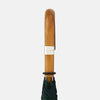 View 5 of product The Turnbull & Asser Black Watch Tartan Traveller Umbrella features a Malacca crook handle and a dark green and navy blue plaid canopy, shown against a plain white background.