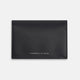 A navy full-grain leather bi-fold card holder with neat stitching and "Turnbull & Asser" embossed in white near the bottom center.