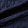 View 4 of product The Turnbull & Asser Navy Double-Breasted Quilted Gilet is a sleeveless piece with an asymmetrical button closure, chest pocket, and two zippered side pockets, shown on a plain white background—ideal for layered dressing.