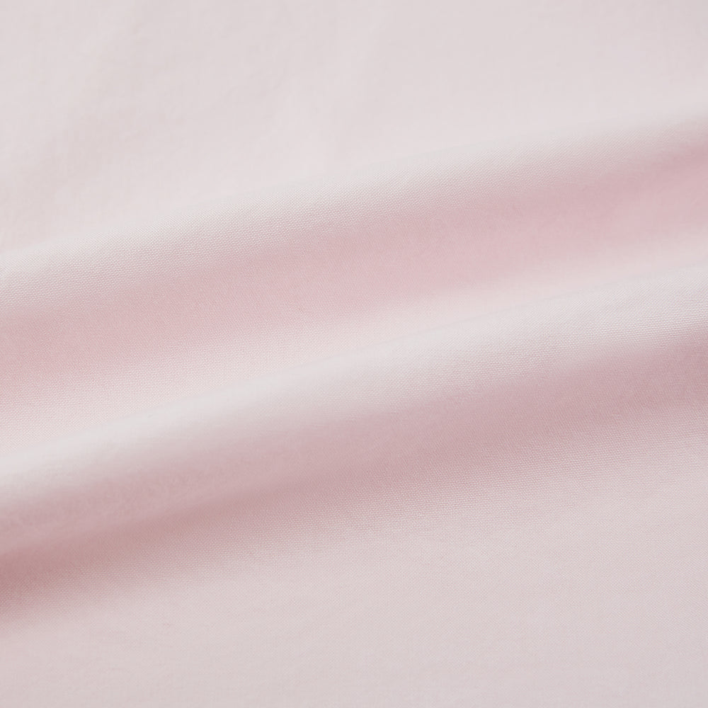 The Soft Pink Hyde Overshirt by Turnbull & Asser features long sleeves, sanforised cotton, dark buttons, and a left front pocket, shown laid flat on a white background.