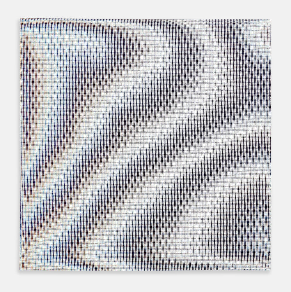 The Turnbull & Asser Navy Blue Shadow Grid Check Hand-Rolled Handkerchief showcases a small, evenly spaced blue and white check pattern and hand-rolled edges, neatly displayed against a white background.