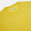 View 2 of product The Turnbull & Asser Canary Yellow Merino Round Neck Jumper features long sleeves and a crew neckline, shown here against a white background.