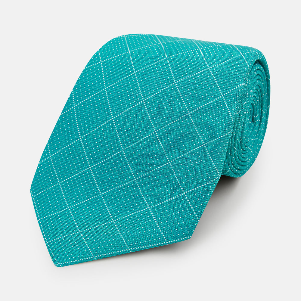 The Turnbull & Asser Turquoise Dotted Check Pattern Printed Silk Tie is shown rolled up on a plain white background.