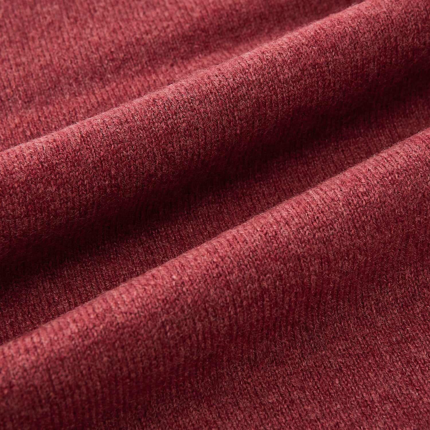 Image 3 of product The Turnbull & Asser Plain Antique Pink Cashmere Knitted Scarf is neatly folded and knotted against a plain white background.