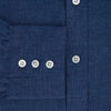 View 4 of product The Turnbull & Asser Navy Linen Mayfair Shirt features long sleeves, a button-up front with white buttons, pointed collar, buttoned cuffs, and a classic fit in solid dark blue linen, shown on a white background.