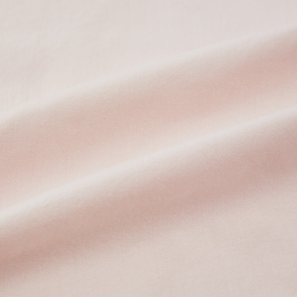 The Turnbull & Asser Pale Pink Hyde Overshirt is a long-sleeve, sanforised cotton button-up with a left chest pocket and dark buttons, shown laid flat on a white background.