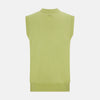 View 3 of product The Melon Green Fine Merino V-Neck Sleeveless Cardigan by Turnbull & Asser features a ribbed collar, five dark brown buttons, and two front pockets—adding sophisticated style to any ensemble, shown against a plain white background.