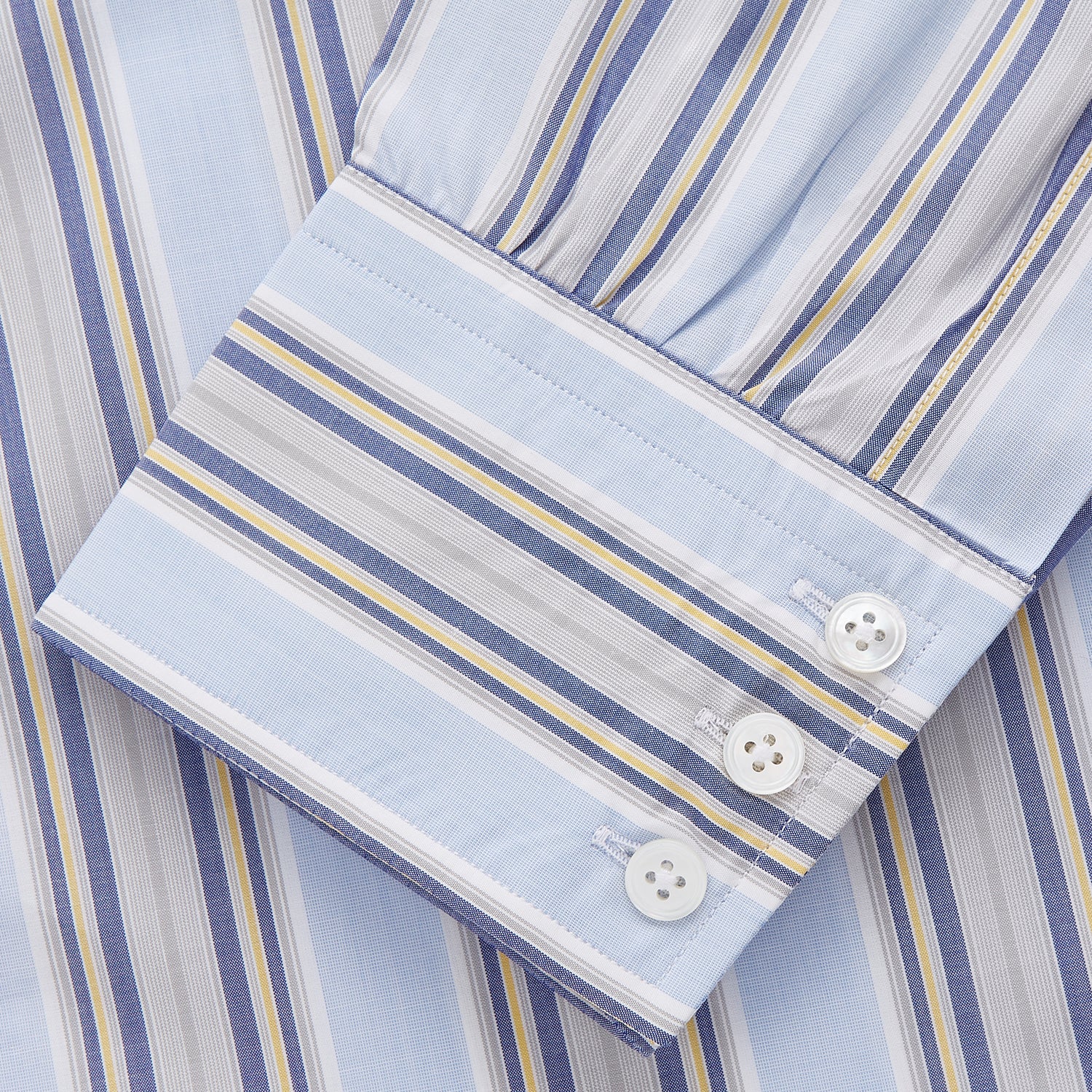 View 3 of product The Turnbull & Asser Pale Blue and Yellow Stripe Cotton Regular Fit Mayfair Shirt is a long-sleeve, button-down formal shirt for men, shown on a plain white background.