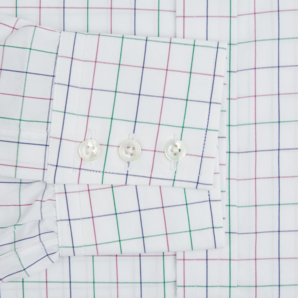 The Turnbull & Asser Pink Grid Check Mayfair Shirt is a long-sleeve, button-down shirt with a T&A collar, crafted from organic cotton and featuring a pink checkered grid pattern on white with buttoned cuffs.