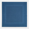 View 4 of product The Blue Dot Silk Pocket Square by Turnbull & Asser features small black polka dots on blue silk and is made in England. The image shows it neatly folded, with a corner turned down to display both sides.