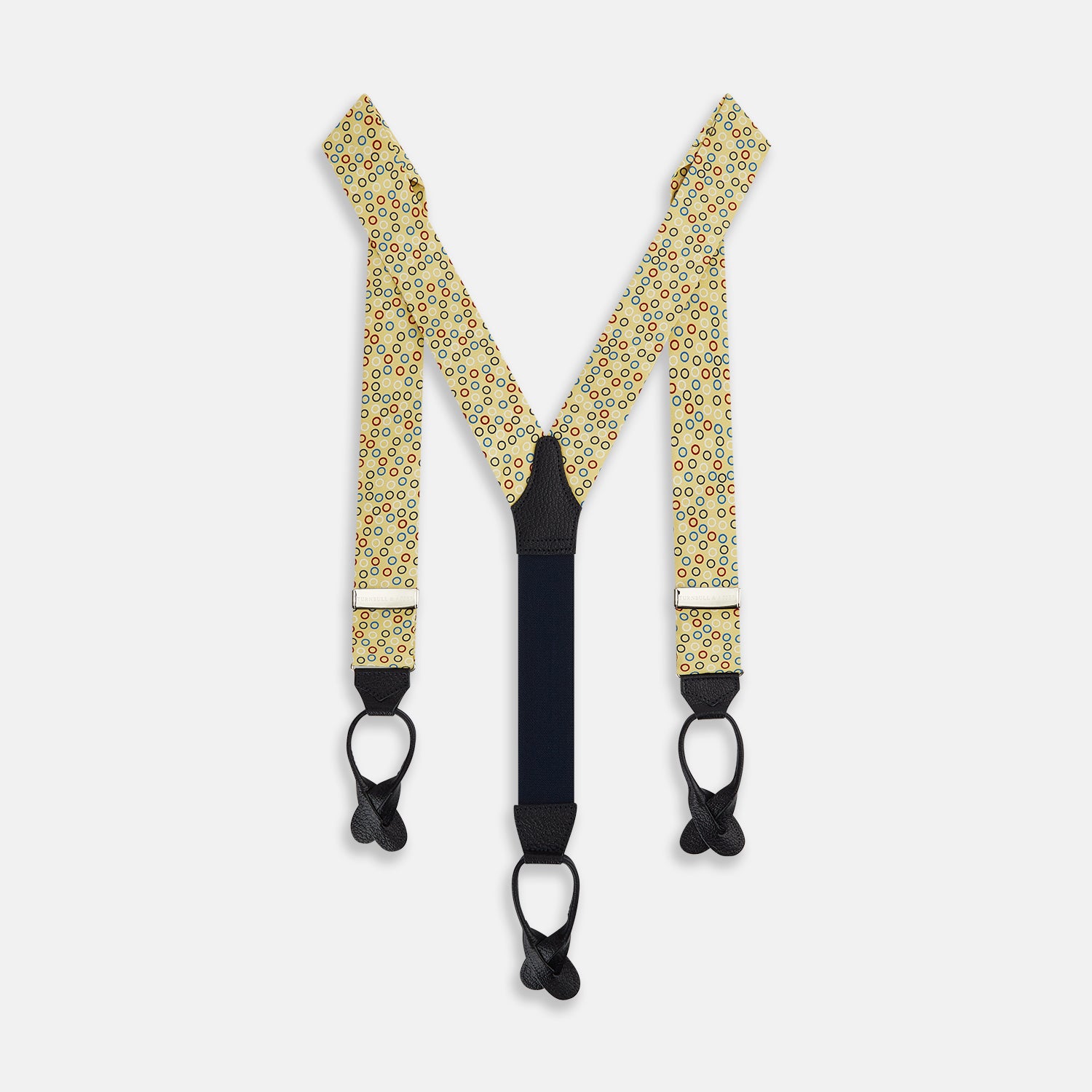 Image 1 of product Turnbull & Asser Multi-coloured Circle Yellow Adjustable Silk and Navy Leather Braces, featuring gold-toned metal clips, bring refined style to any outfit. Shown laid flat on a white background.