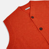 View 2 of product The Turnbull & Asser Red Orange Cashmere Sleeveless Cardigan features a ribbed collar, hem, and armholes, button-down front, and two front pockets—perfect as a refined light layer, shown against a white background.