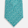 View 3 of product The Turnbull & Asser Turquoise Flower Patterned Printed Silk Tie, crafted from fine English silk, is neatly rolled on a white background.
