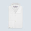 View 1 of product The Turnbull & Asser Two-Fold 120 White Shirt with a Regent collar and 3-button cuffs is neatly folded and displayed against a light blue background.
