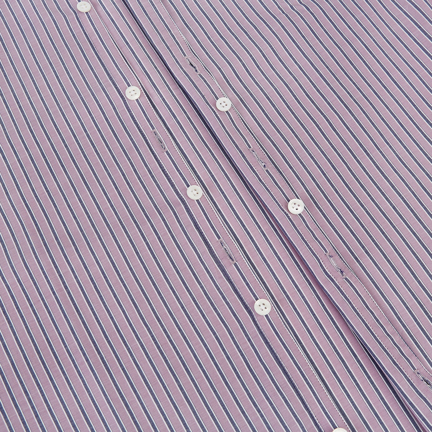 Image 7 of product The Turnbull & Asser Antique Pink Ticking Stripe Westminster Shirt is a collared, long-sleeve button-up with thin vertical pink stripes on white, highlighting British craftsmanship. It’s shown neatly laid flat and fully buttoned.