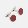View 1 of product Turnbull & Asser's Red Circle Cufflinks feature round sterling silver with bold red enamel centers, offering a refined accessory for gentlemen, shown on a white background.