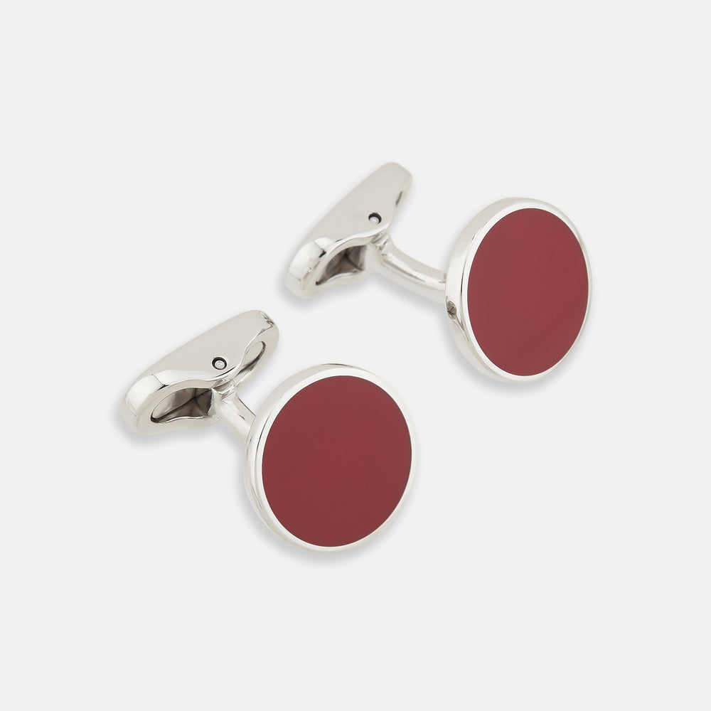 Turnbull & Asser's Red Circle Cufflinks feature round sterling silver with bold red enamel centers, offering a refined accessory for gentlemen, shown on a white background.