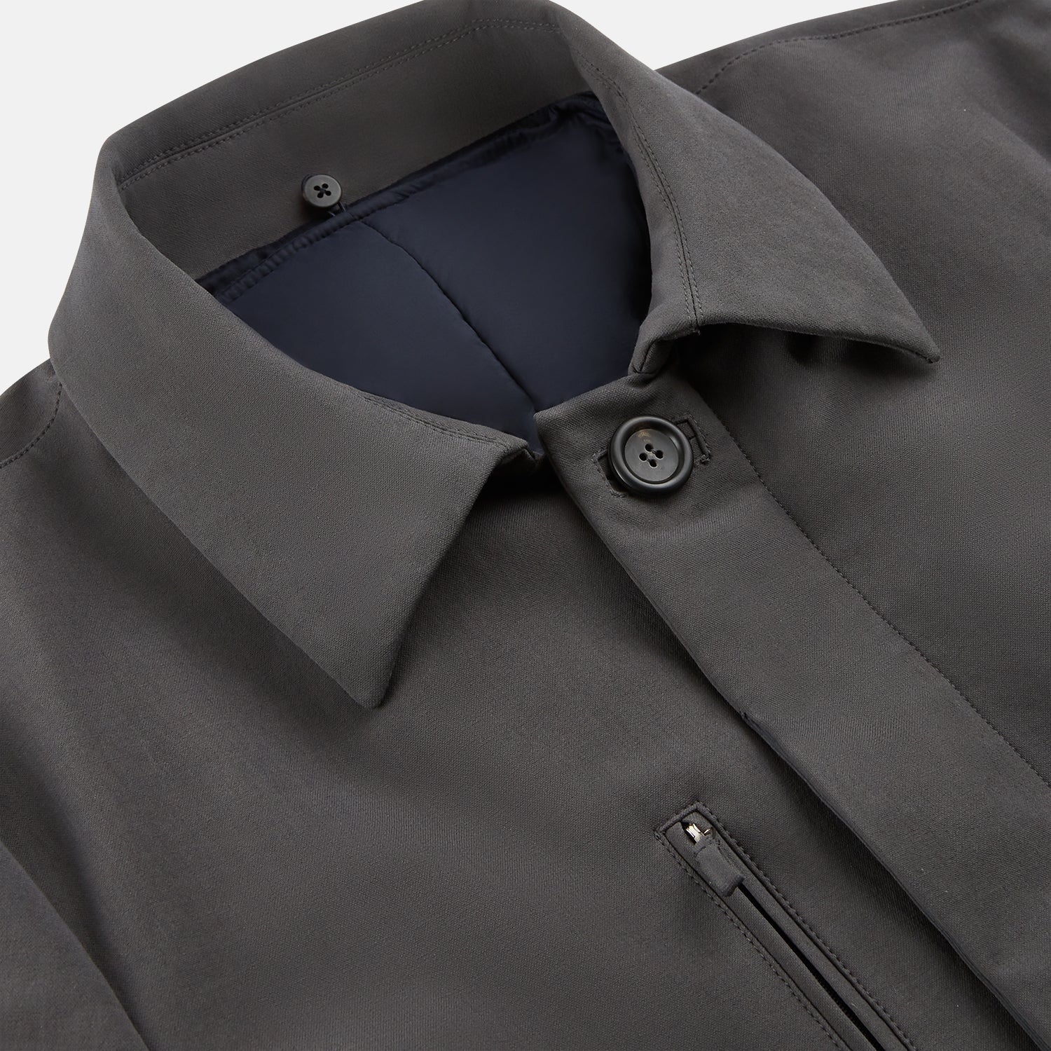 View 2 of product The Turnbull & Asser Charcoal Melange John Arthur Trench Coat, featuring a collar, single-breasted closure, and three zippered pockets—one chest and two at the hips—is shown against a plain white background.