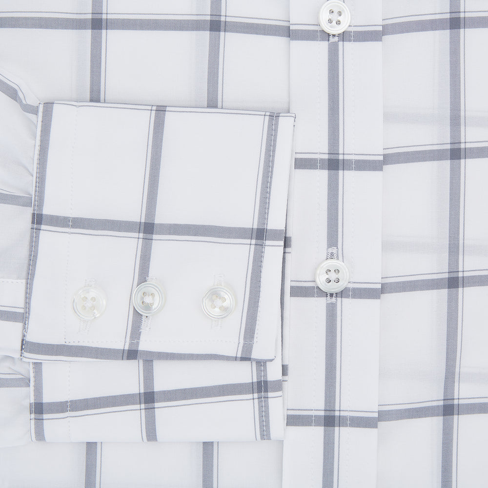 The Turnbull & Asser Grey Grid Check Mayfair Shirt features a classic collar and buttoned cuffs, crafted from fine Italian cotton with a grey grid check on white, and is shown against a plain white background.