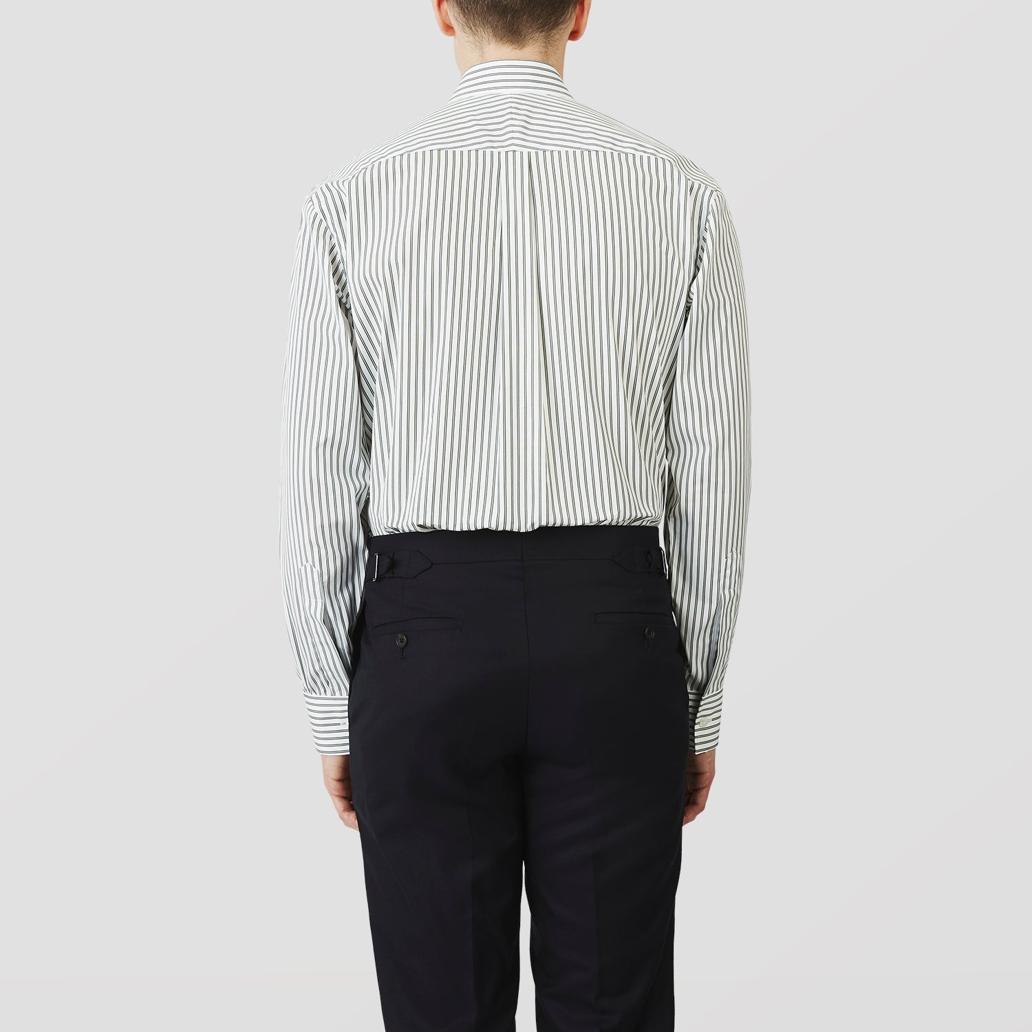 View 3 of product The Turnbull & Asser Green Stripe Weekend Fit Shirt features a derby collar, 1-button cuffs, and relaxed fit, perfect for smart-casual style, shown laid flat on a white background.