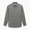 View 1 of product The Pale Charcoal Westminster Shirt by Turnbull & Asser features British craftsmanship with a tailored silhouette, long sleeves, pointed collar, buttoned cuffs, and a solid pale charcoal hue, elegantly shown against a white background.