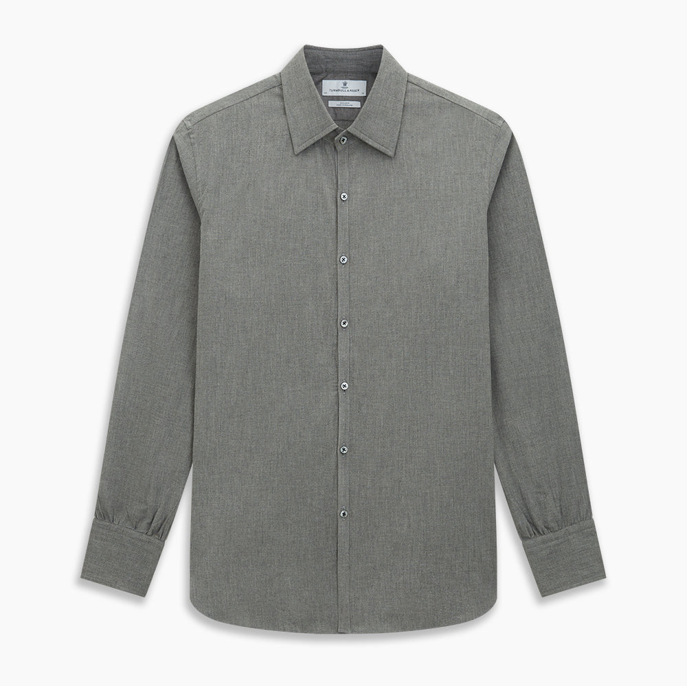 The Pale Charcoal Westminster Shirt by Turnbull & Asser features British craftsmanship with a tailored silhouette, long sleeves, pointed collar, buttoned cuffs, and a solid pale charcoal hue, elegantly shown against a white background.
