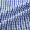View 6 of product Turnbull & Asser's Blue and Navy Multi Check Piccadilly Shirt features long sleeves, a pointed collar, and two buttoned chest pockets, shown on a white background.