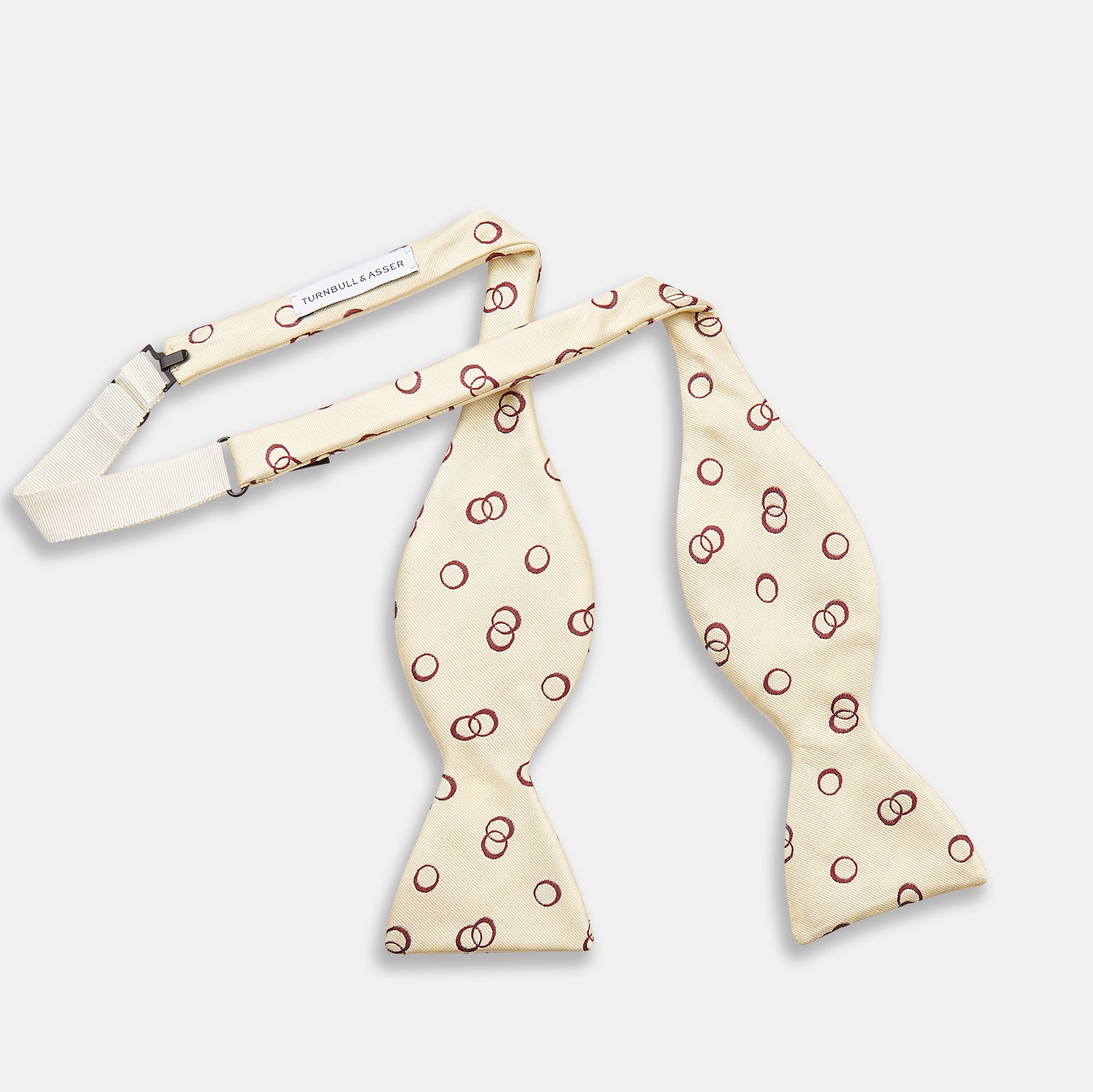 View 2 of product The Yellow Geometric Rings Silk Bow Tie by Turnbull & Asser features interlocking rings in a bold geometric pattern, crafted from silk.