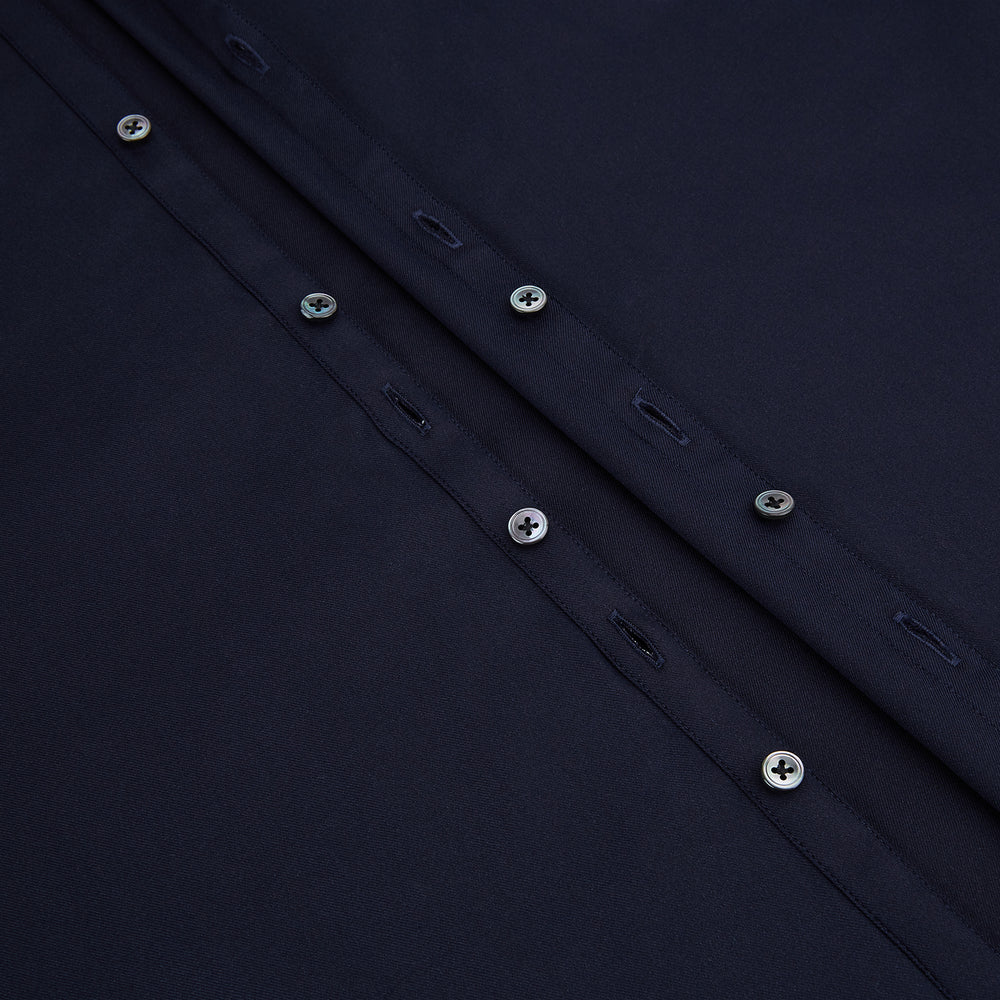 The Navy Twill Windsor Shirt by Turnbull & Asser features long sleeves, a button-up front, British craftsmanship, and a refined Windsor collar, shown in dark navy on a plain white background.