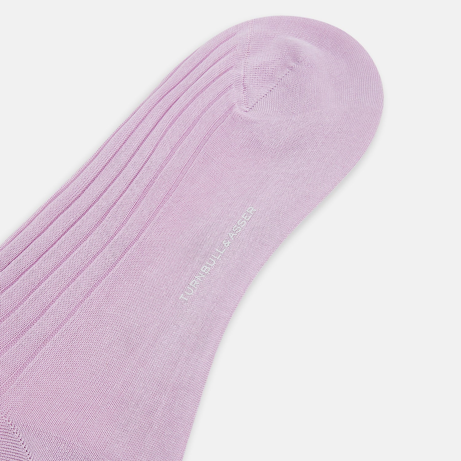 View 3 of product A single, knee-high Rose Long Sock by Turnbull & Asser, in light purple ribbed mercerised cotton, is displayed upright on a plain white background.