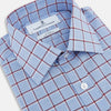 View 2 of product The Turnbull & Asser Blue and Burgundy Windowpane Mayfair Shirt features long sleeves, a light blue base with burgundy windowpane checks, a classic collar, and white buttons.