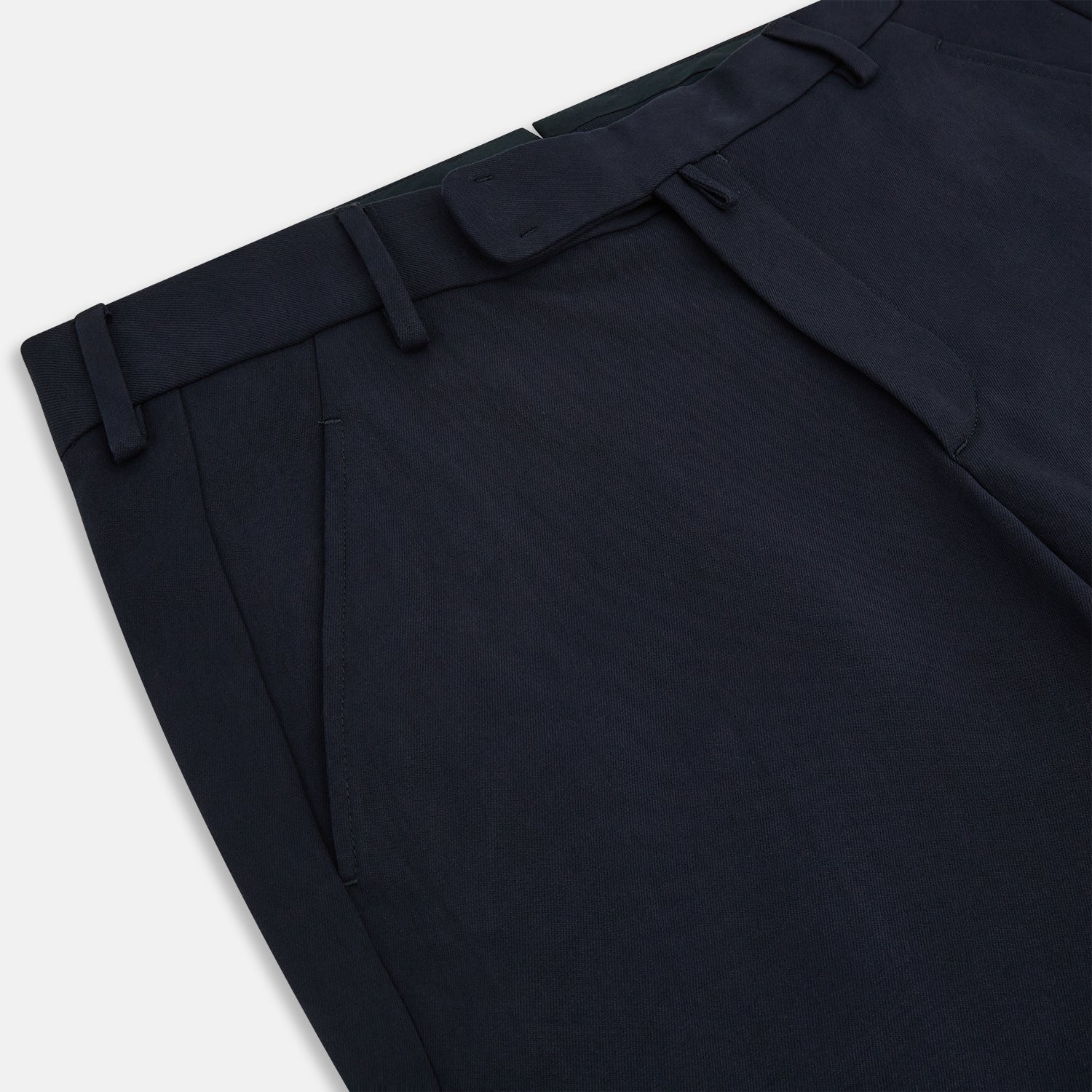 View 2 of product A pair of Navy Henry B Trousers by Turnbull & Asser, crafted from fine Italian cotton with belt loops, a flat front, and straight-leg design, displayed against a plain white background.