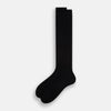 View 2 of product A single Turnbull & Asser Black Cotton Long Sock is shown upright on a white background, featuring a ribbed texture along the leg and foot with a smooth finish at the top.