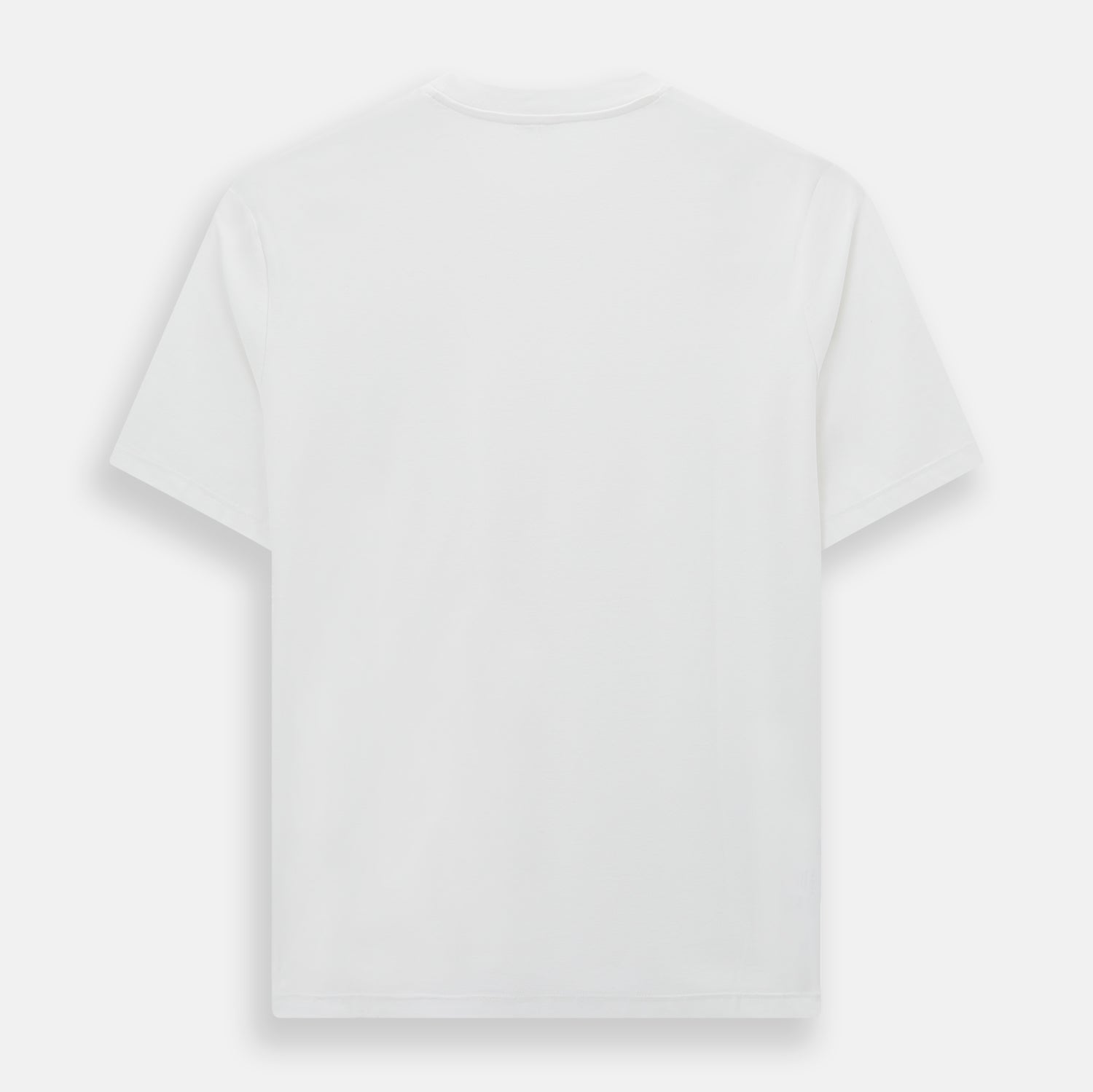 View 3 of product Experience comfort in the Turnbull & Asser White Short-sleeve Pyjama Shirt—a plain crew neck T-shirt laid flat on a white background, perfect as elevated loungewear or a sleek pyjama essential.
