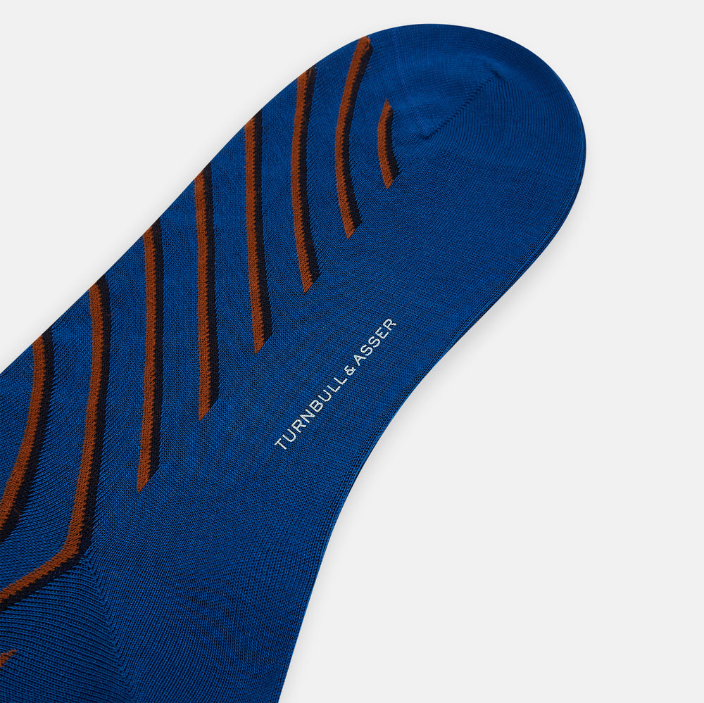 A single Turnbull & Asser Royal Blue/orange Diagonal Striped Long Sock is shown in a knee-high style against a plain light gray background.