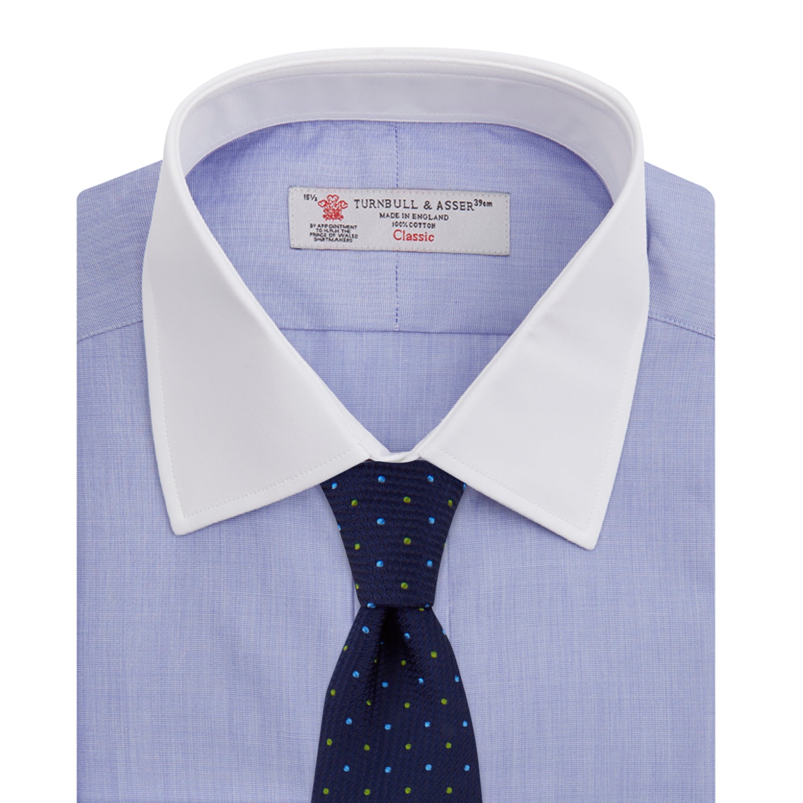 View 4 of product The Wall Street Shirt with White T&A Collar by Turnbull & Asser, as seen on Gordon Gekko, is folded neatly to showcase its light purple color, crisp French cuffs, and iconic contrasting collar against a plain background.